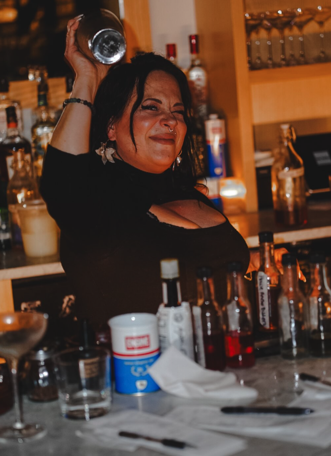 Cocktails raised at a Bar Torino table